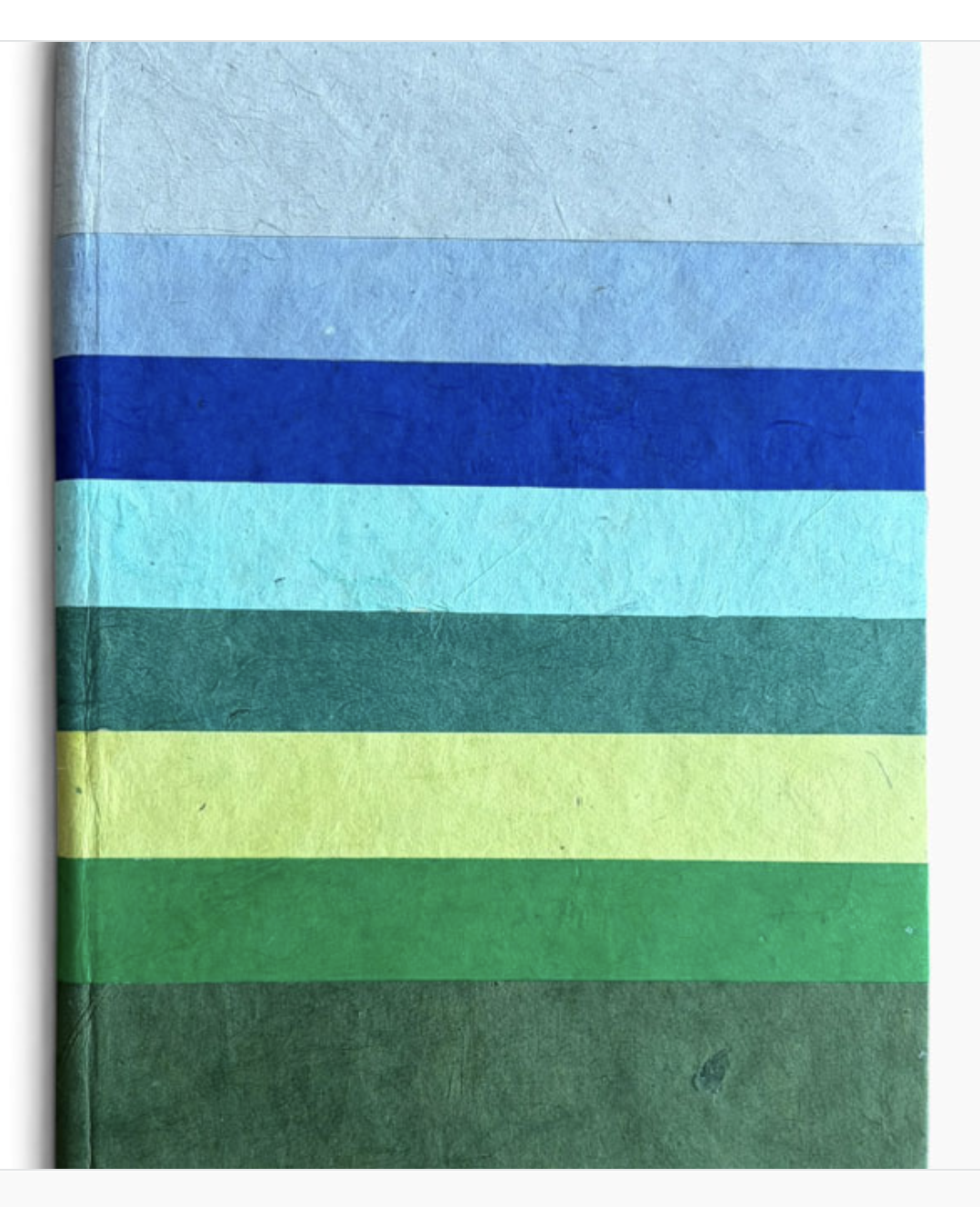 A6 notitieboek met regenboog kaft en 120 ivoorkleurige pagina's